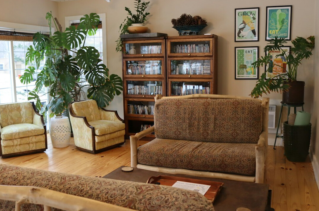 Quiet reading room with tall wooden bookshelves