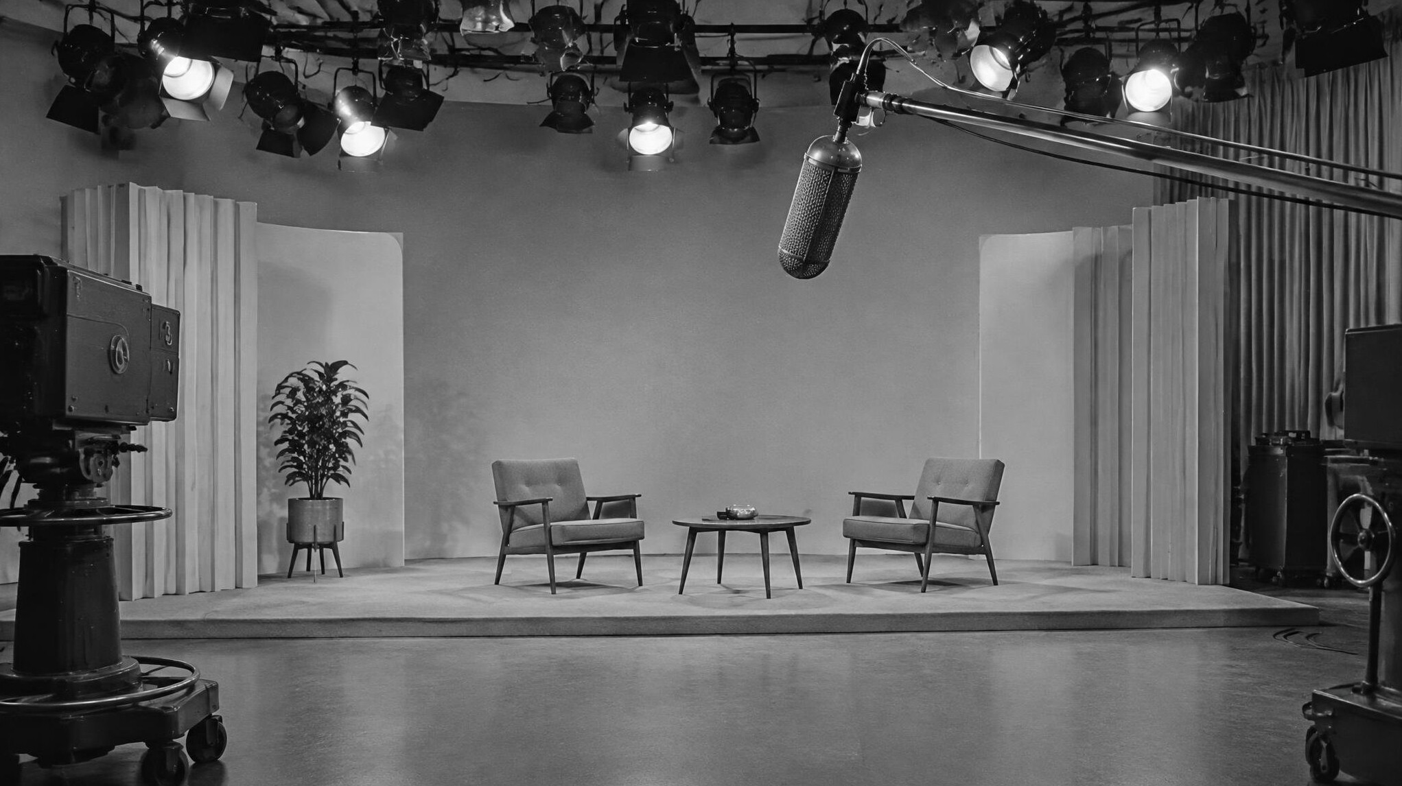 Empty vintage television studio set with large boom microphone