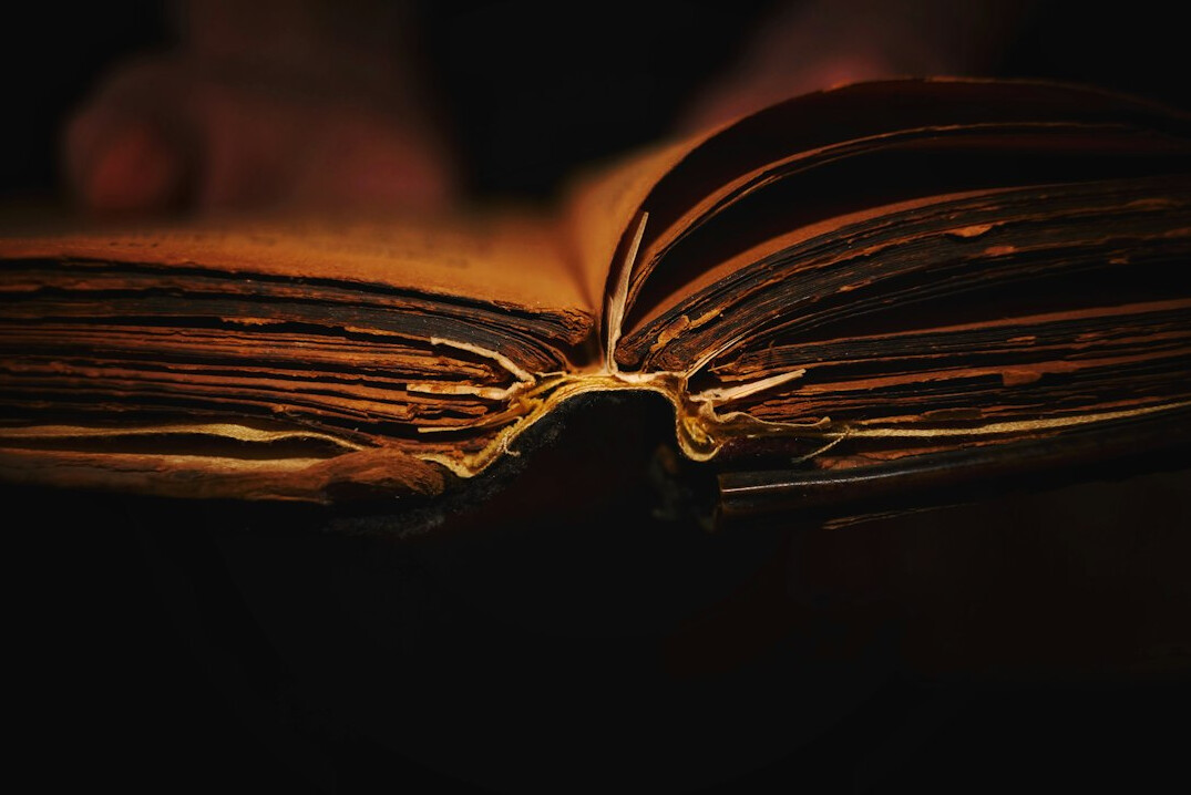 Open old book with aged pages