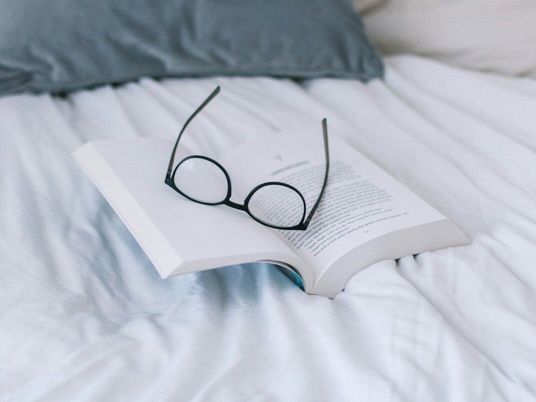 Book pages with reading glasses