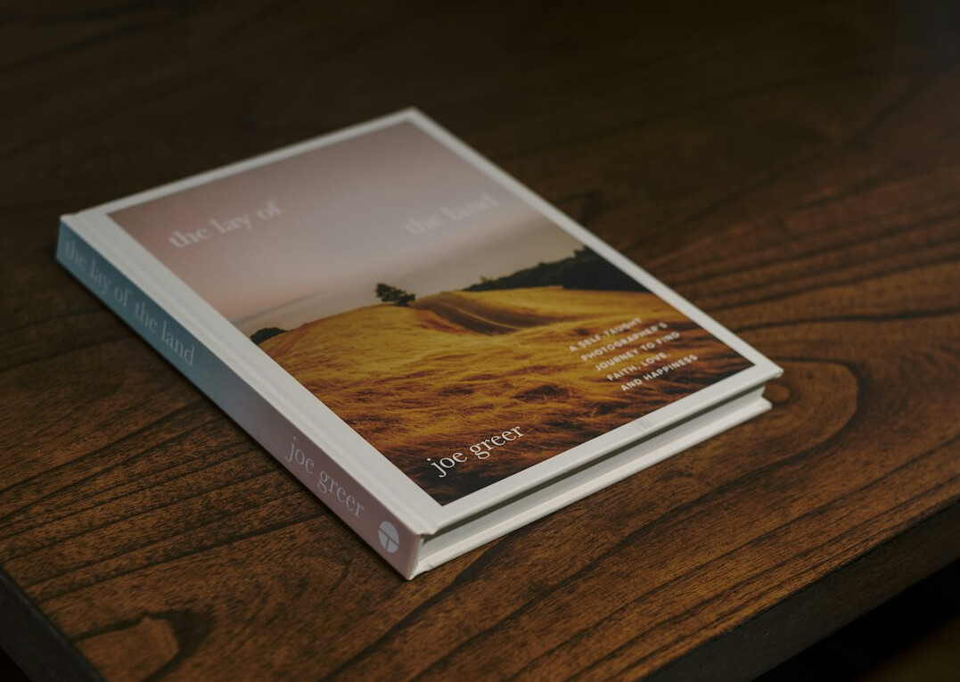 Hardcover book standing on a table with soft light